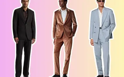 Three men in stylish suits, ready for a cocktail attore event. One in black, another in velvet brown, and the third in a light blue double-breasted suit.