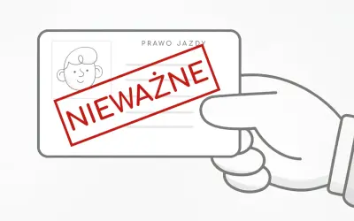 Dłoń trzyma nieważne prawo jazdy. Brak dokumentu to potencjalny mandat.
