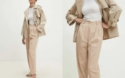 Eleganckie spodnie dla starszych pań w beżowym kolorze, z modnymi zakładkami. Idealne do stylowych, codziennych zestawów.