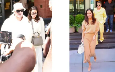 Inés de Ramón, con un conjunto beige, camina sonriente mientras Brad Pitt, con un llamativo traje amarillo, desciende escaleras.