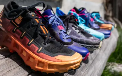 Une rangée de chaussures de trail hiver colorées, prêtes pour l'aventure.