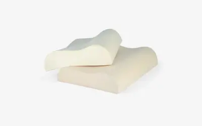 Two ergonomic pillows designed for neck pain relief. These almohadas para dolor de cuello offer contoured support for a comfortable sleep.