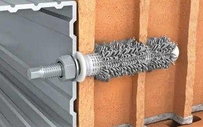 Przekrój pokazujący kotwy chemiczne mocujące profil aluminiowy do cegły.