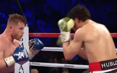 Boxers in a ring, one in a classic Mexican style boxing stance, throwing a punch.