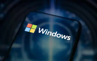 Logo Windows 10 na ekranie smartfona. Sprawdź, jakie są windows 10 wymagania, by cieszyć się płynnością działania.