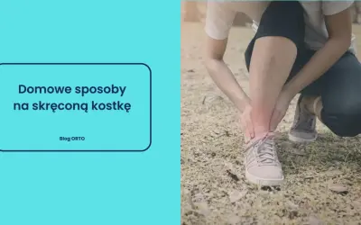 Osoba trzymająca się za czerwoną, bolącą kostkę w butach sportowych.