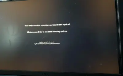 Ekran komputera z komunikatem błędu "Your device ran into a problem and couldn't be repaired.