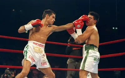 Ricardo "El Finito" Lopez lands a punch on his opponent during a boxing match.