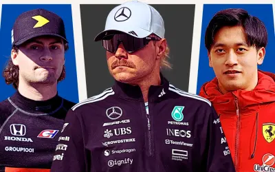 Trzech kierowców formuły 1: z lewej kierowca w czarnej bluzie z żółtym symbolem, w środku kierowca Mercedesa w białej czapce i okularach, z prawej kierowca Ferrari w czerwonej kurtce.