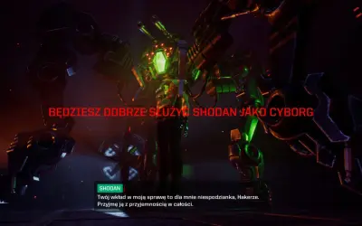 Potężny cyborg z zielonymi światłami i bronią groźnie patrzy na gracza. Tekst "BĘDZIESZ DOBRZE SŁUŻYĆ SHODAN JAKO CYBORG" sugeruje, że gracz stanie się częścią tej maszyny.