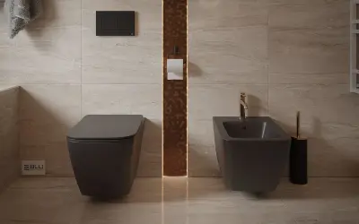 Nowoczesna łazienka z podwieszanym WC i bidetem. Dowiedz się, jak siadać na bidet, by higiena była komfortowa.