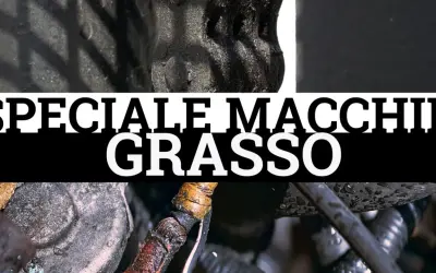Dettaglio di componenti meccanici con macchie di unto evidenti. Testo "SPECIALE MACCHIE GRASSO".