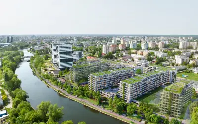 Nowoczesne osiedle apartamentowe z zielonymi dachami nad rzeką w Bydgoszczy.
