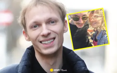 Igor Herbut z żoną na zdjęciu. Uśmiechnięty wokalista i jego ukochana w słoneczny dzień.