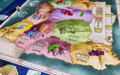 El grande gra: kolorowe pionki graczy rywalizują o kontrolę nad regionami Hiszpanii na planszy gry.