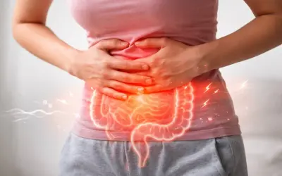 Dolore e tensione addominale con un'illustrazione luminosa dell'intestino.