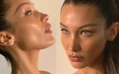 Bella Hadid figura w zbliżeniu, z uwydatnionymi rysami twarzy i delikatnym makijażem.