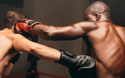 Two boxers in a ring, one throwing a punch while the other slips, demonstrating effective boxing combos with slips.