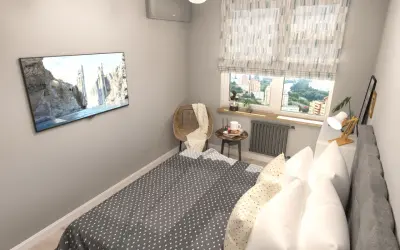 Gemütliches Schlafzimmer mit Bett, Fernseher und Fensterblick. Tolle Schlafzimmer Ideen für kleine Räume.