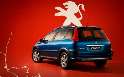 Niebieski Peugeot 206 SW z białym lwem na czerwonym tle.
