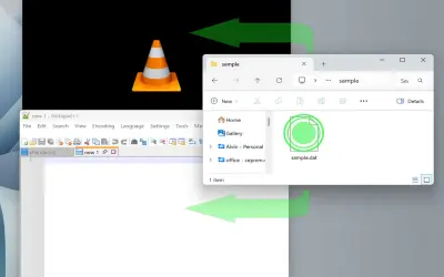 El VLC media player muestra un cono naranja. Una flecha verde indica cómo abrir archivos .dat desde el explorador de archivos.
