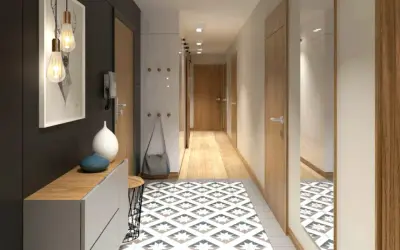 Un corridoio stretto con idee di design moderne: tappeto geometrico, mobili minimalisti, luci a sospensione e specchio a tutta altezza.