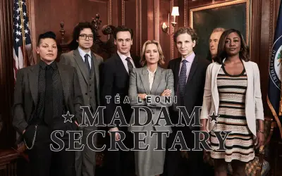 Obsada serialu "Madam Secretary" w eleganckich strojach, gotowa do działania.
