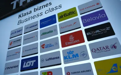 Ranking linii lotniczych w klasie biznes. Widoczne loga przewoźników: LOT, Emirates, KLM, Lufthansa, Qatar Airways i inne.