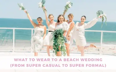 Bridesmaids in white dresses celebrate by the ocean. Thinking about what to wear to a beach wedding male? This image offers inspiration for stylish beach attire.