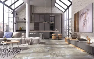 Nowoczesny salon z industrialnymi akcentami. Na podłodze piękne, wzorzyste płytki, które dodają charakteru.