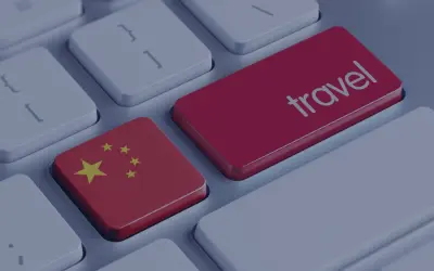 Klawisz z flagą Chin i klawisz "travel" obok siebie. Planujesz podróż do Chin i potrzebujesz wizy?