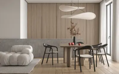 Jadalnia w stylu minimalistycznym: drewniane panele, betonowy blat, jasna sofa, drewniany stół z krzesłami i ozdobna lampa.