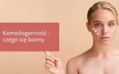 Komedogenność - czego się boimy. Młoda kobieta z białymi kropkami kremu na policzku, symbolizującymi potencjalne składniki komedogenne.