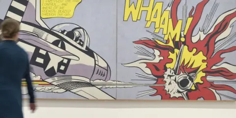 A 1950s pop art diptych depicts a jet firing rockets, with "WHAAM!" exploding in vibrant colors.