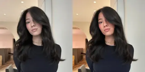 Une jeune femme aux cheveux bruns et brillants, pose avec un sourire subtil. Elle porte un col roulé noir et des colliers fins. On se demande combien de temps dure un gloss cheveux pour obtenir un tel éclat.
