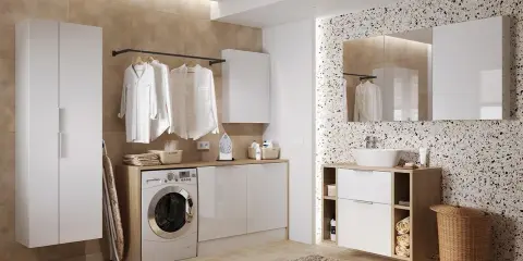 Nowoczesna pralnia z pralką pod blatem, szafkami i miejscem na suszenie ubrań. Idealne rozwiązanie, jak zabudować pralkę, by stworzyć funkcjonalną przestrzeń.