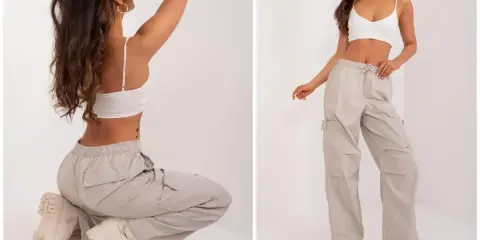 Modelka prezentuje luźne, beżowe spodnie cargo i biały top. Idealne pytanie: jakie buty do kulotów? Grube trapery świetnie uzupełniają ten look.