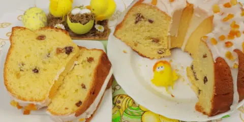 Puszysta babka drożdżowa z lukrem i kandyzowaną skórką, ozdobiona wielkanocnymi kurczaczkami.