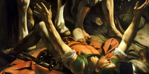 La conversion de saint Paul par Caravage : Paul, tombé de cheval, reçoit la lumière divine. Ses bras levés implorent, tandis que les jambes du cheval dominent la scène.