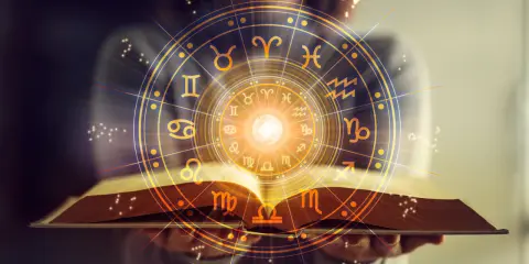 Otwarta księga z kręgiem znaków zodiaku. Horoskop Bliźnięta zdrowie – odkryj swój potencjał.