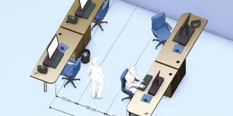 Aménagement de bureaux illustrant l'ergonomie : distances entre postes de travail et circulation.