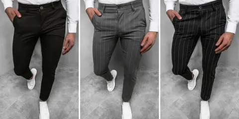 Trzy pary męskich spodni: gładkie ciemne, w pionowe paski szare i czarne. To są chinosy, idealne na co dzień i do eleganckich stylizacji.