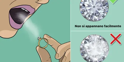Test per verificare se i diamanti veri si appannano. Un soffio d'aria su un anello con diamante.