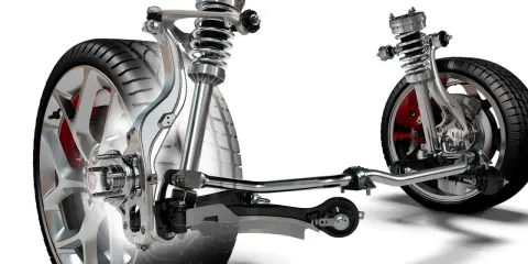 Wyświetla mechanizm zawieszenia w samochodzie z amortyzatorami, sprężynami i elementami układu kierowniczego.