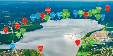Widok na Zalew Rybnicki z zaznaczonymi atrakcjami: plaże, restauracje, sporty wodne, trasy rowerowe i miejsca rekreacji.