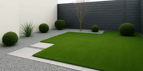 Modern garden with artificial grass, gravel, concrete paths and spherical bushes. Ideas para jardin con cesped artificial.
