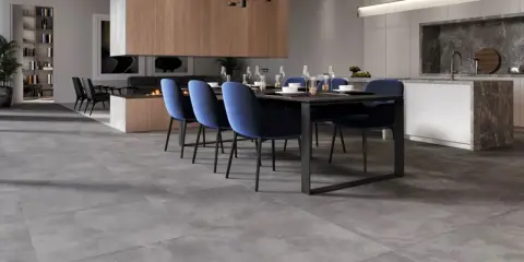 Nowoczesna kuchnia z jadalnią. Betonowe płytki na podłodze i kamienne blaty to świetne inspiracje.