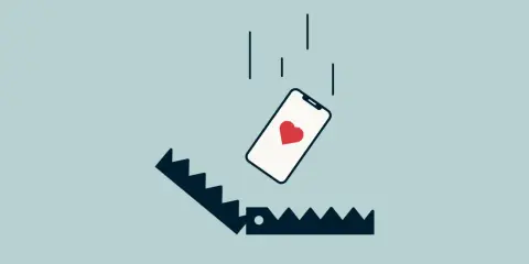 Telefon z sercem spada w pułapkę. Ilustracja symbolizuje rzeczy, o których kłamiemy na portalach randkowych, by zwabić ofiarę.