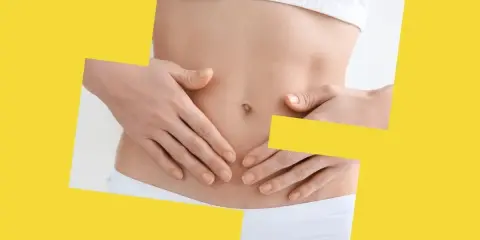 Dłonie na brzuchu, symbolizujące potencjalne maślan sodu skutki uboczne, takie jak dyskomfort.