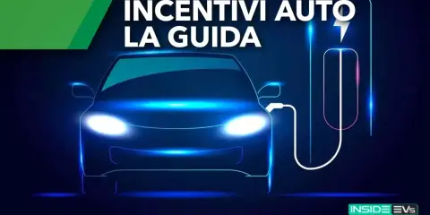 Auto elettrica in ricarica, con testo "Incentivi Auto La Guida". Scopri come ottenere i tuoi incentivi auto elettrica.